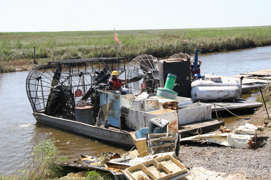 Huge three-engine airboat to haul away large tanks