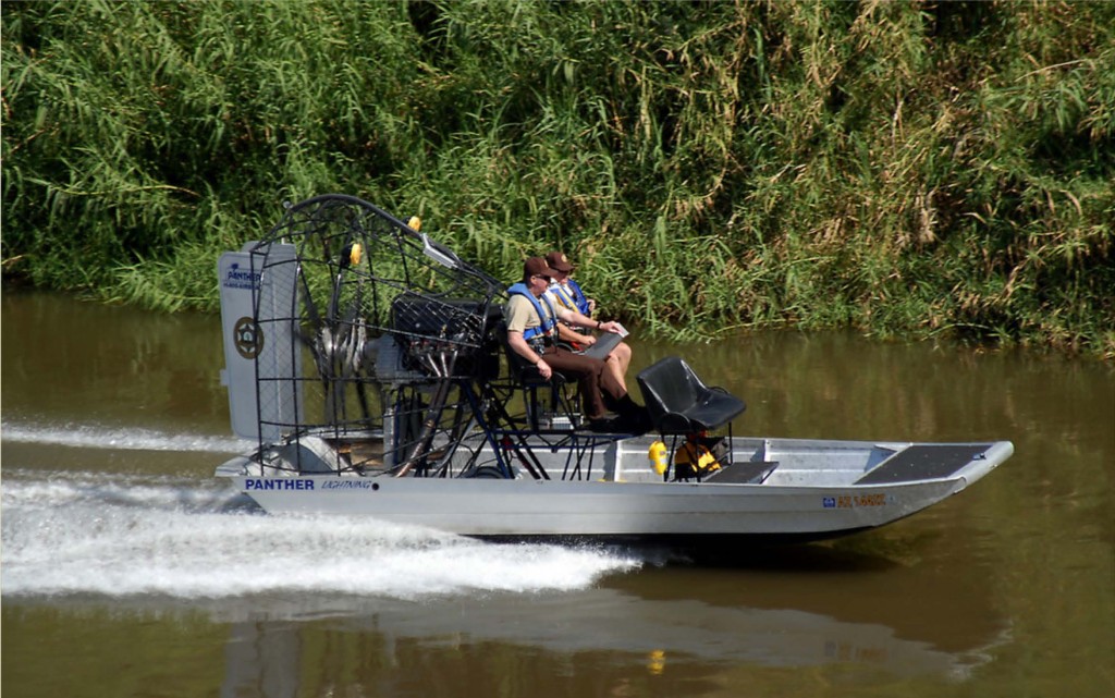 Yuma County Sheriff's Office Lt. Darren Simmons, right, and Major Leon Wilmot, ply the waters of the lower Colorado River. They were demonstrating the department's new Airboat which enables them to pass over water as shallow as a few inches. The new boat will enhance their ability to enforce boating and other laws on a part of the river that is sometimes difficult to reach with other types of watercraft. photo: Terry Ketron