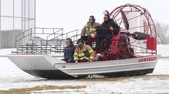High River fire fighters try out their new Air Ranger behind Highwood High School during the Flood Preparedness Expo. It's another tool in their tool box for rescues, according to Len Zebedee, fire chief.