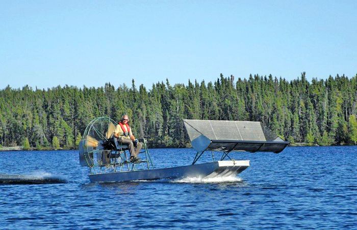 Bob Anderson pilots an airboat equipped with a hopper.